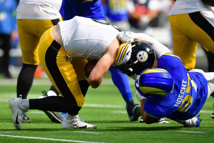 Pittsburgh Steelers quarterback Kenny Pickett (8) is brought down by Los Angeles Rams linebacker Michael Hoecht (97) during the first half at SoFi Stadium.